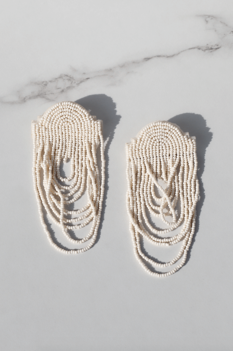 Less is more white statement earring