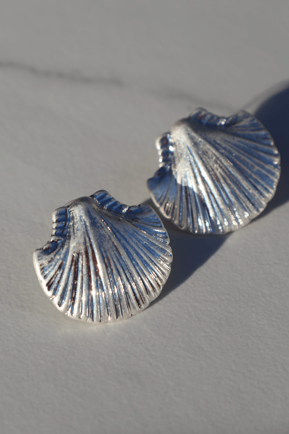 Silver shell statement earring