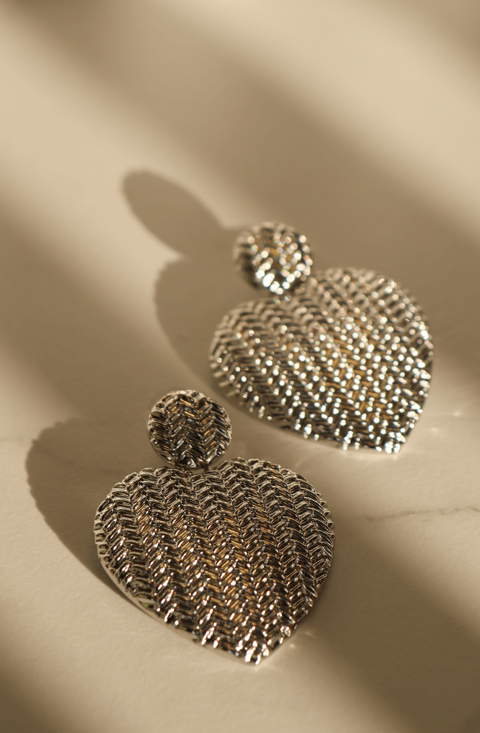 Silver heart statement earring