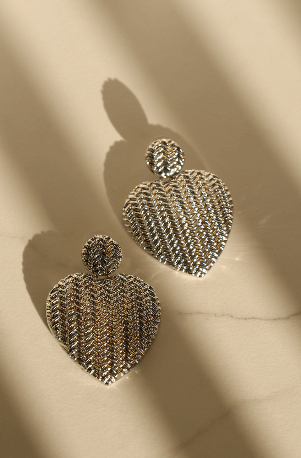 Silver heart statement earring