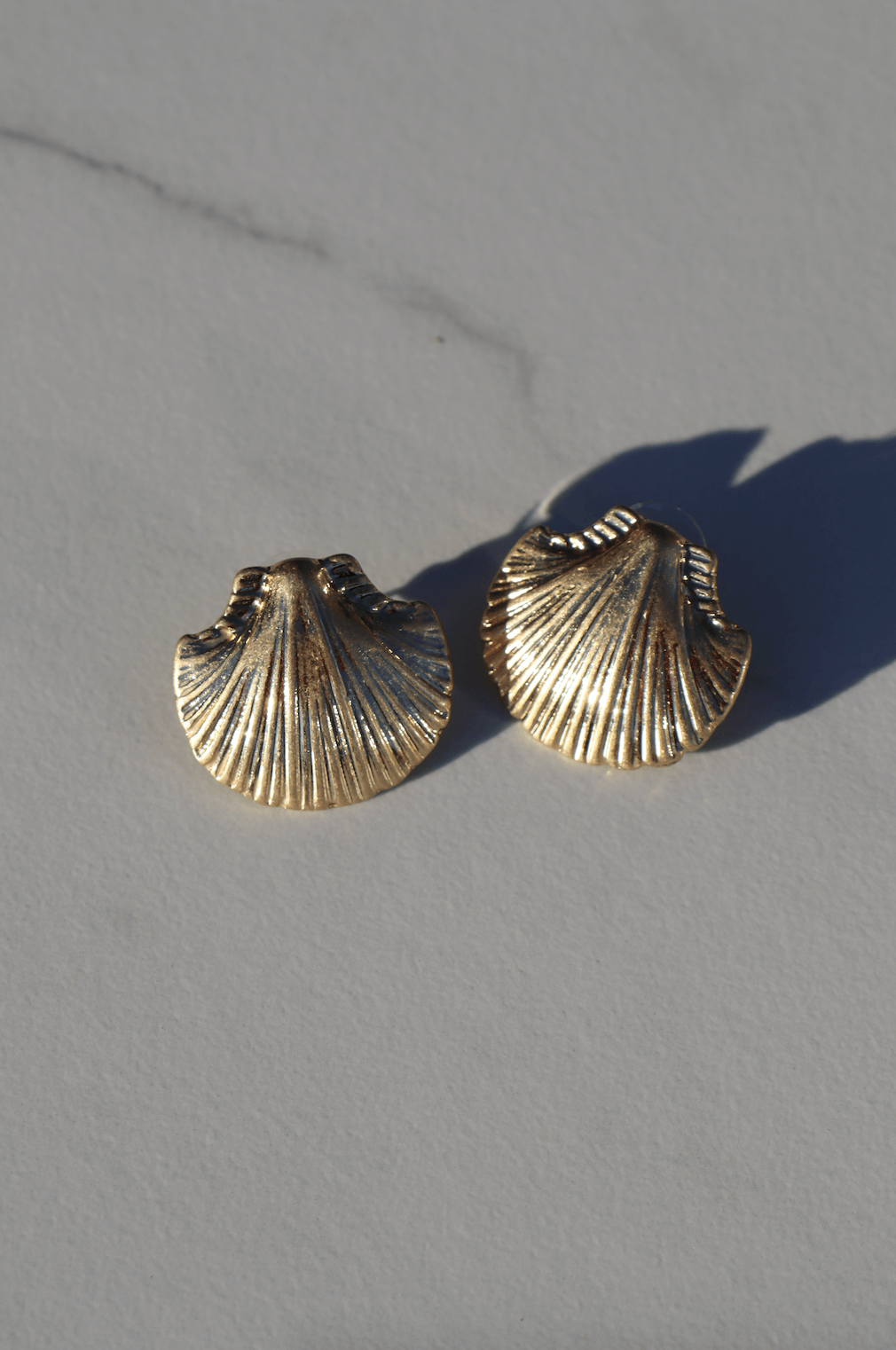 Gold shell statement earring